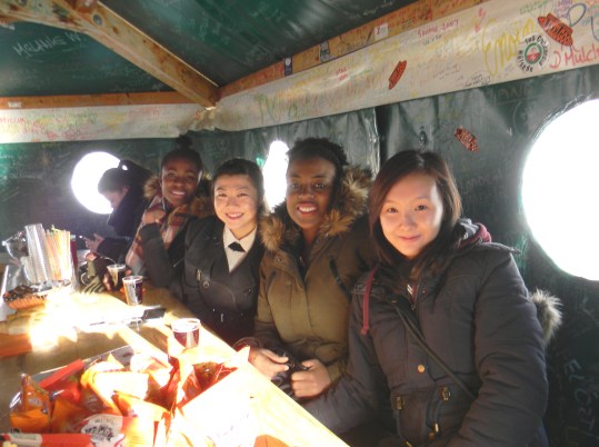 Drinking hot wine with friends in a tippee tent, Klein Scheidegg Switzerland